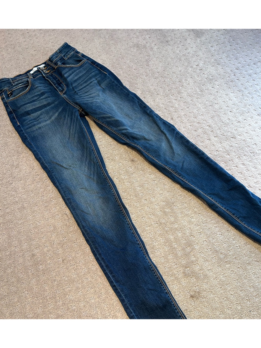 KanCan Women's Skinny Jeans in Dark Blue Wash. raw edge hem.